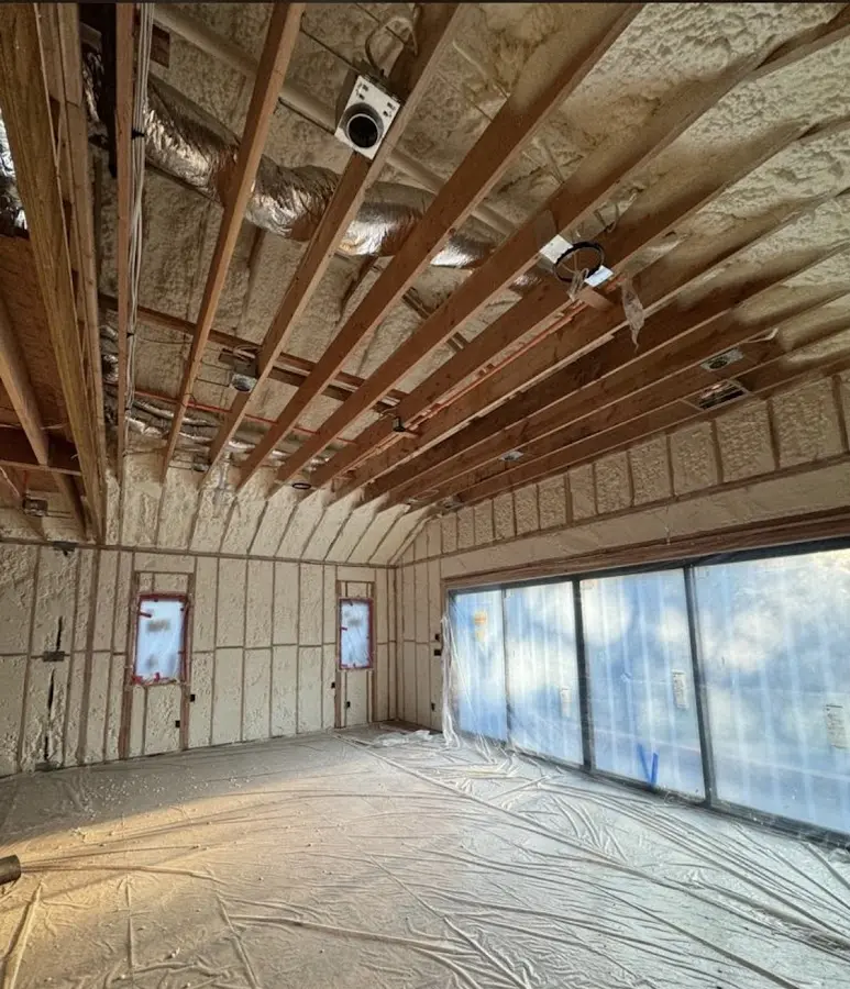 Interior walls and ceiling insulated with spray foam during new construction in Jamesburg